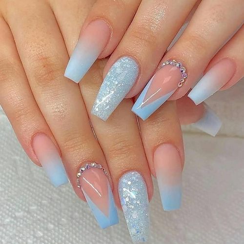 acrylic coffin nails with blue french tips, glitter polish and diamonds