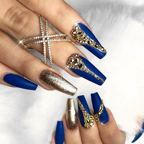 royal blue coffin nails with gold and glitter accents that use diamonds and glitter polish