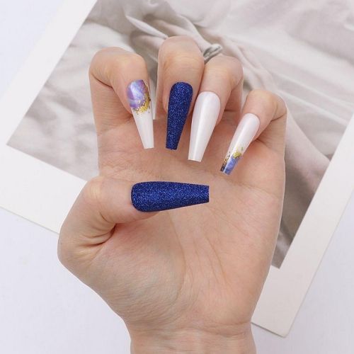 long coffin nails with royal blue glitter, glossy white gel and golden glitter accents