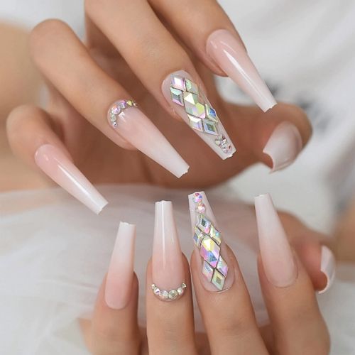 long coffin shaped light beige nails with blong bling jewels