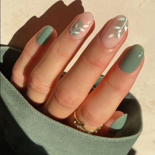 short round sage green nails with beige and white elements