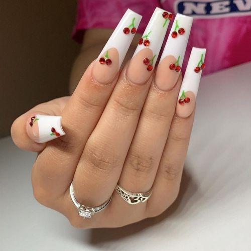 long cherry nails with white french tips and red diamonds