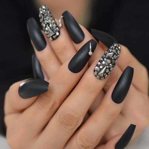 medium length press-on matte black coffin nails with piercing and rhinestones