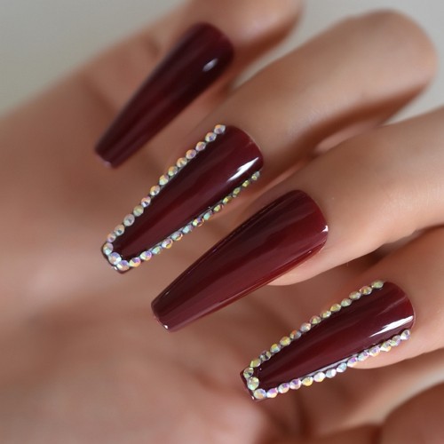 long glossy coffin burgundy nails with rhinestone decorative elements
