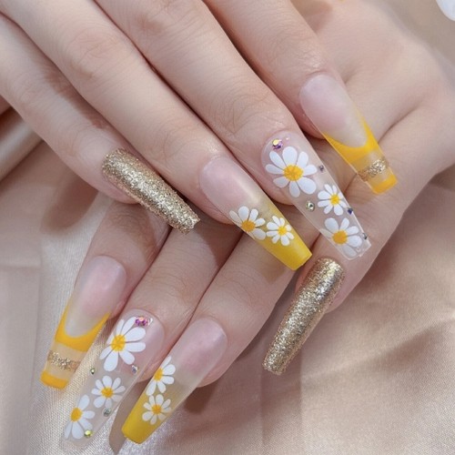 long press-on coffin flower nails with white flowers and yellow accents