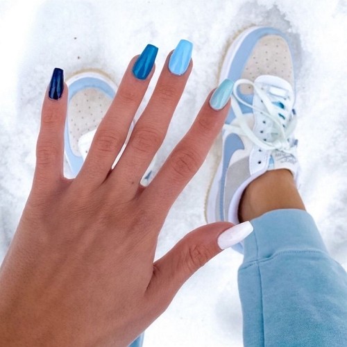 short coffin nails painted in different shades of blue