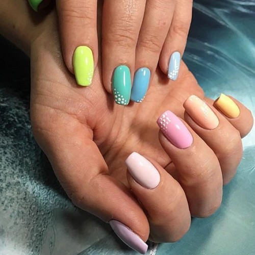short pastel multicolor nails covered with shellac