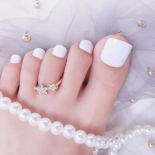 pedicure with plain white square nails and matte finish