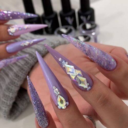 Long purple stiletto press-on coffin nails with rhinestones