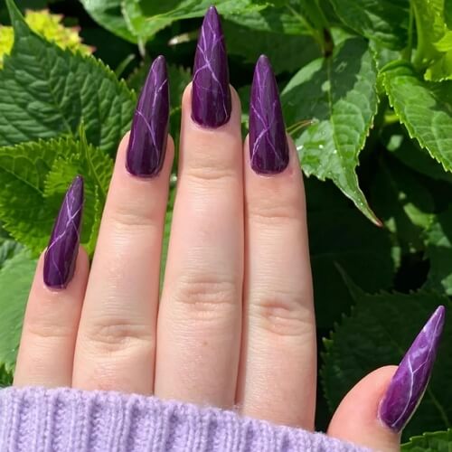 Long sharp-edge goth nails with purple and black colors
